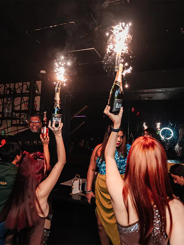 Girls Carrying Bottles in air at Muszik Mmafia Show